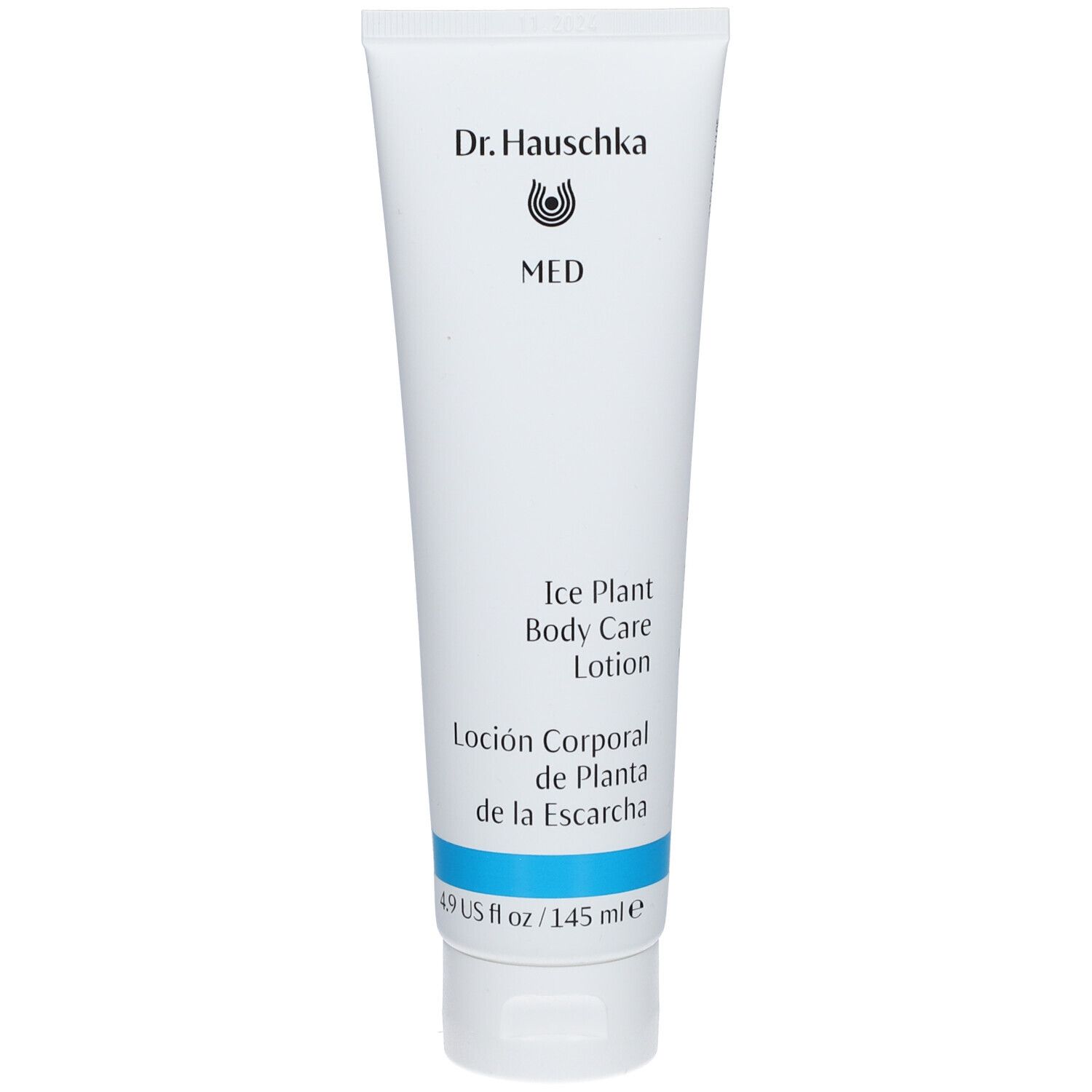 Weiße Tube mit blauer Schrift und Streifen. Aufschrift: Dr. Hauschka MED, Ice Plant Body Care Lotion, Loión Corporal de Planta de la Escarcha.