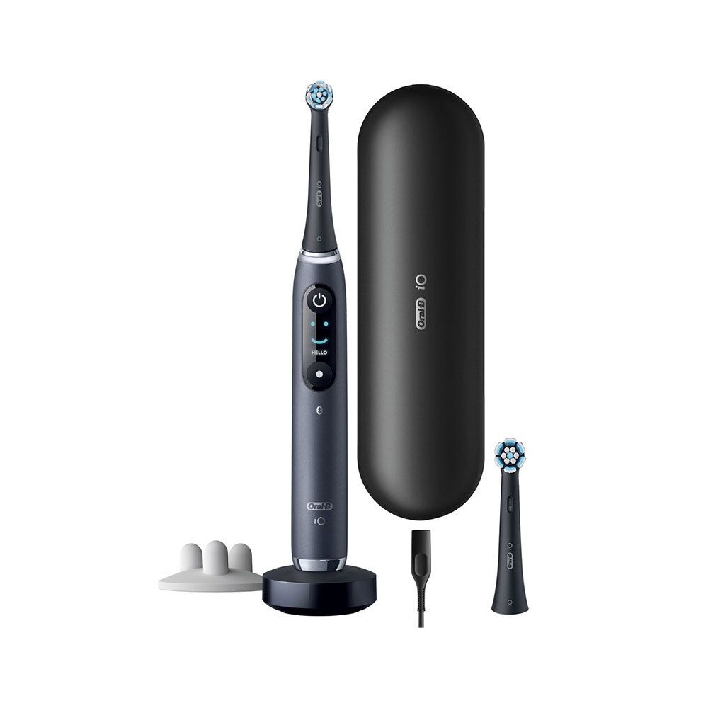 Brosse à dents électrique avec socle de chargement, étui de voyage, tête de brosse de rechange et câble de chargement.