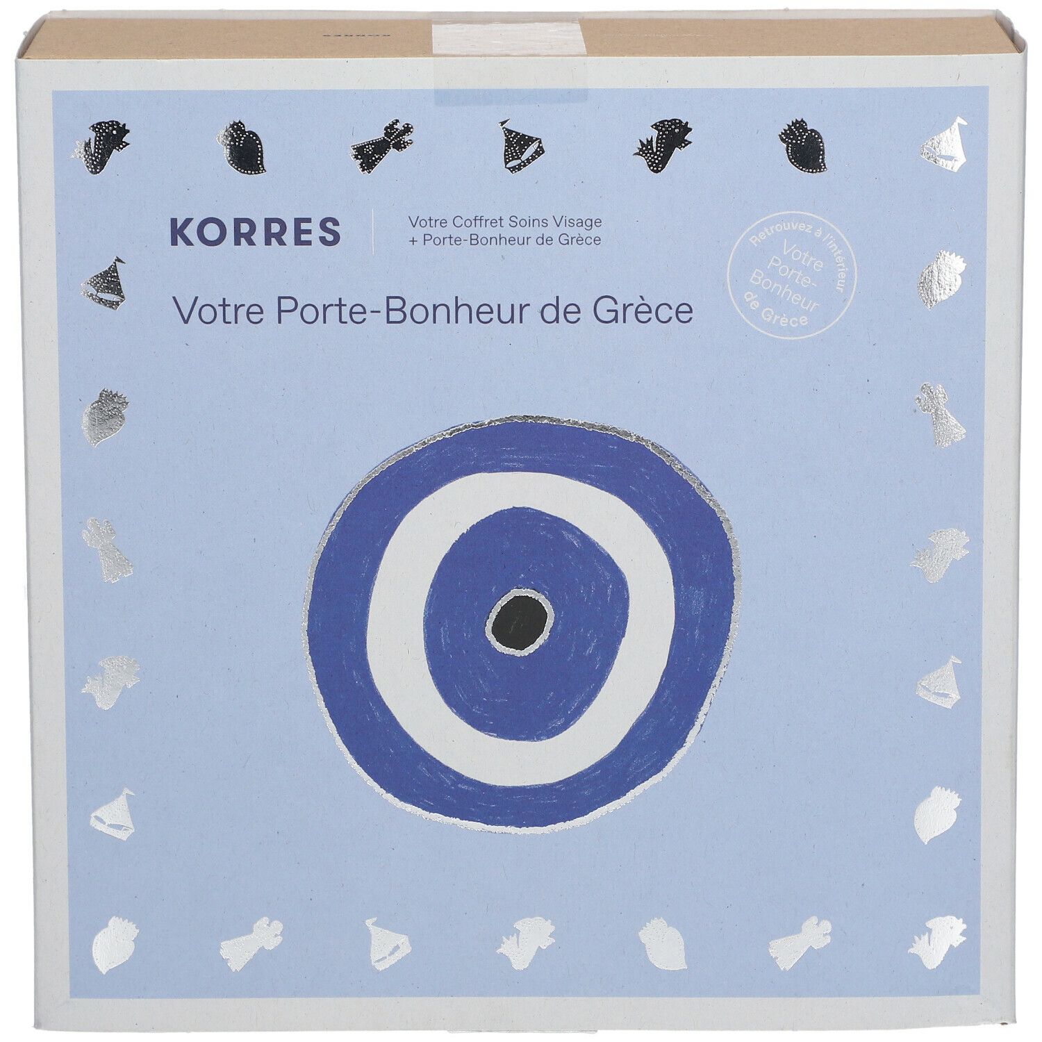 Kartonnen doos Korres met Grieks geluksbrenger-motief. Tekst: Votre Porte-Bonheur de Grèce.