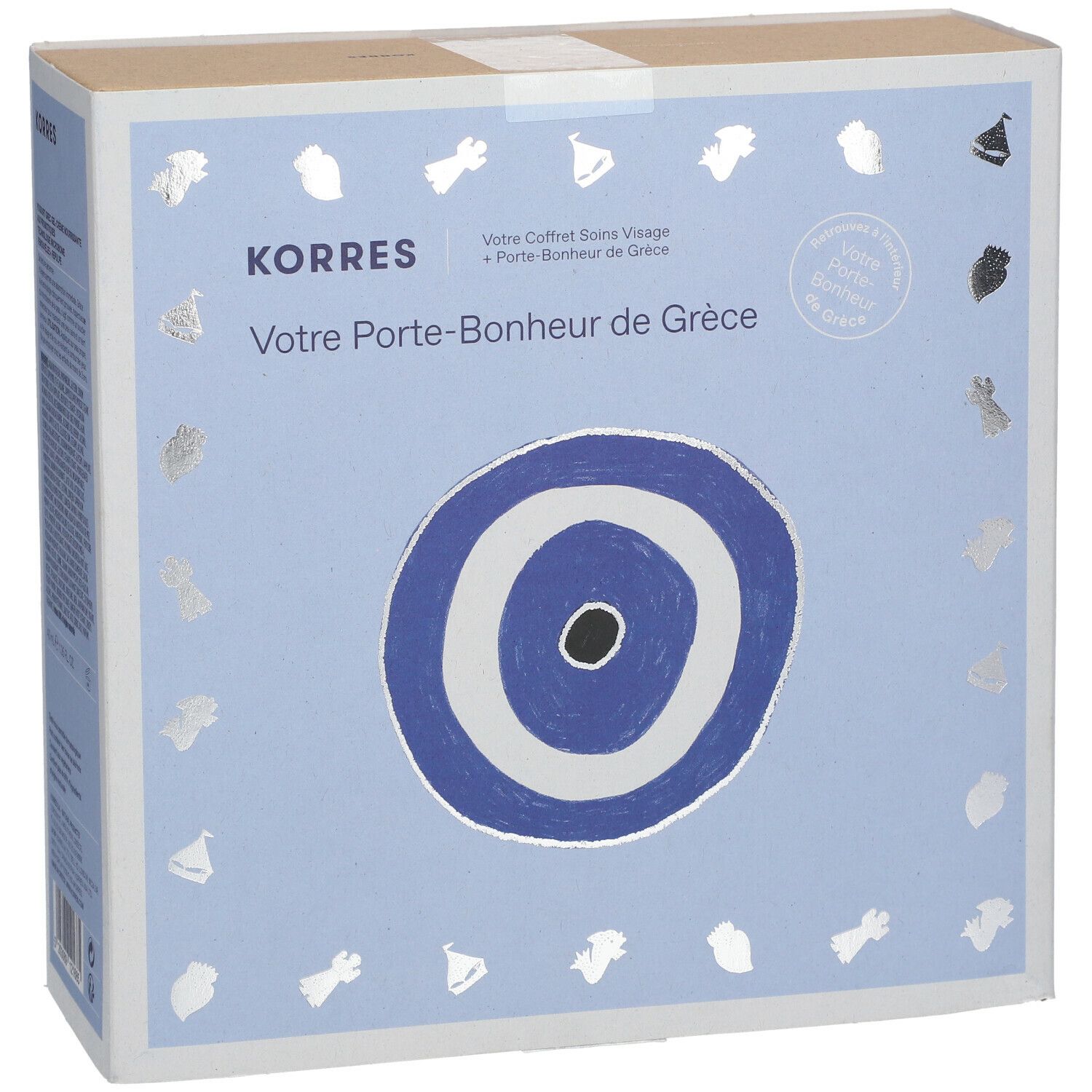 Kartonnen doos Korres met Grieks geluksbrenger-motief. Tekst: Votre Porte-Bonheur de Grèce.