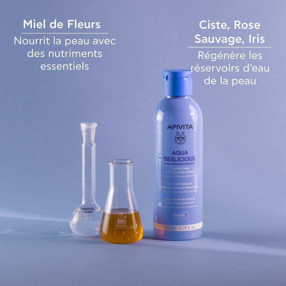 Flacon, ballons et tubes à essai. Texte : Miel, ciste, rose, iris. Texte : Nourrit la peau avec des nutriments essentiels.