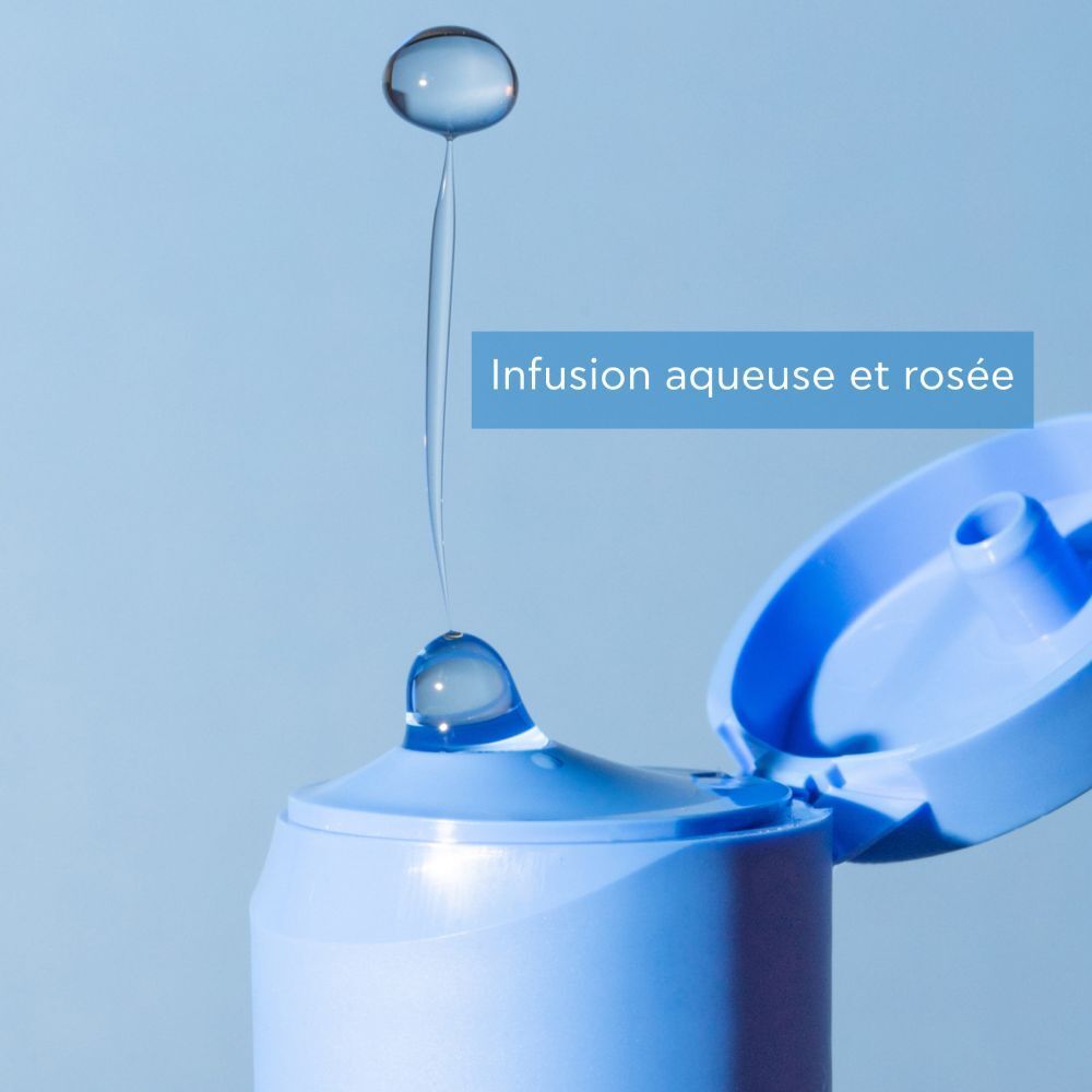 Gouttes tombant d'un flacon. Texte : Infusion aqueuse et rosée.