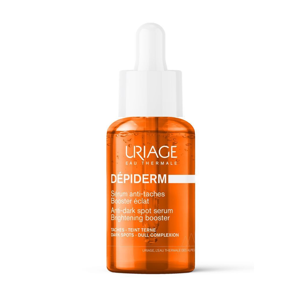 Sérum URIAGE Dépiderm en flacon de verre avec pipette. Liquide orangé.