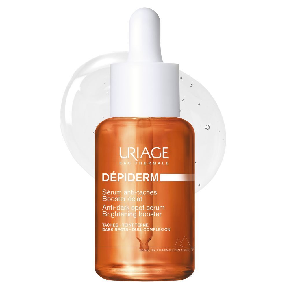 Sérum URIAGE Dépiderm en flacon de verre avec pipette. Liquide orangé.
