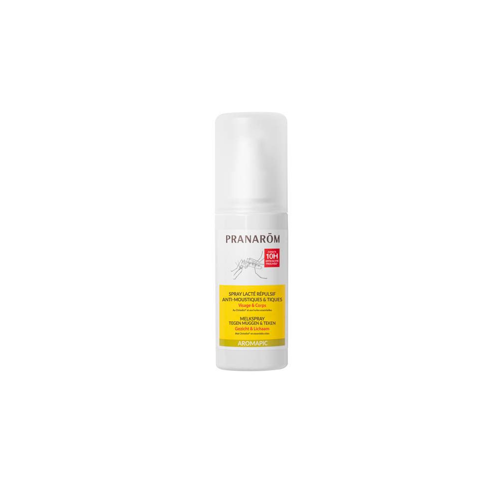 Spray blanc avec bouchon. Inscription: PRANAROM, Spray lacté répulsif anti-moustiques & tiques. Étiquettes jaunes.