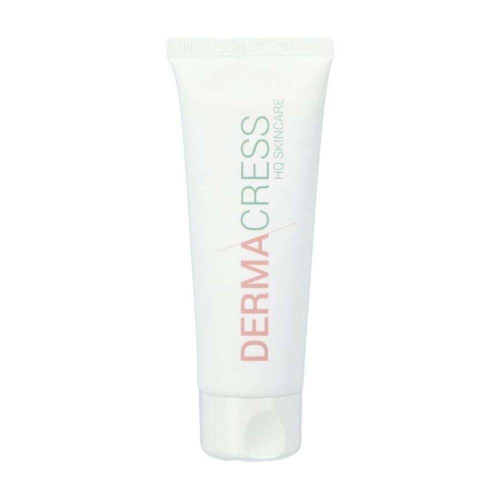Tube blanc avec texte vert et rouge DERMACRESS HQ SKINCARE. Bouchon en bas.