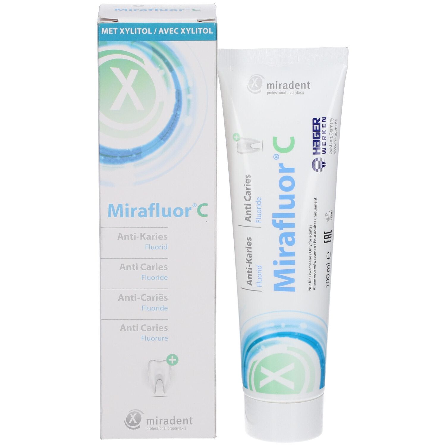 Verpakking en tube Miradent Mirafluor C. Witte doos met tekst en logo. Tube ernaast.