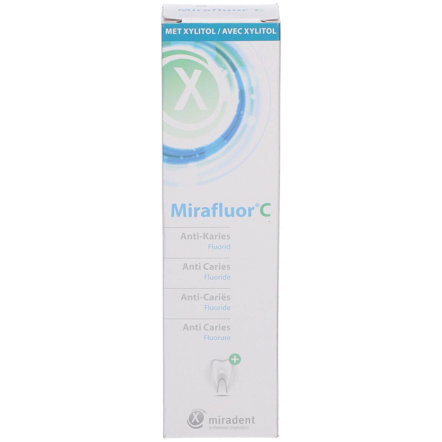 Witte verpakking Miradent Mirafluor C. Tekst: Anti-cariës, Fluoride. Logo en tekst.