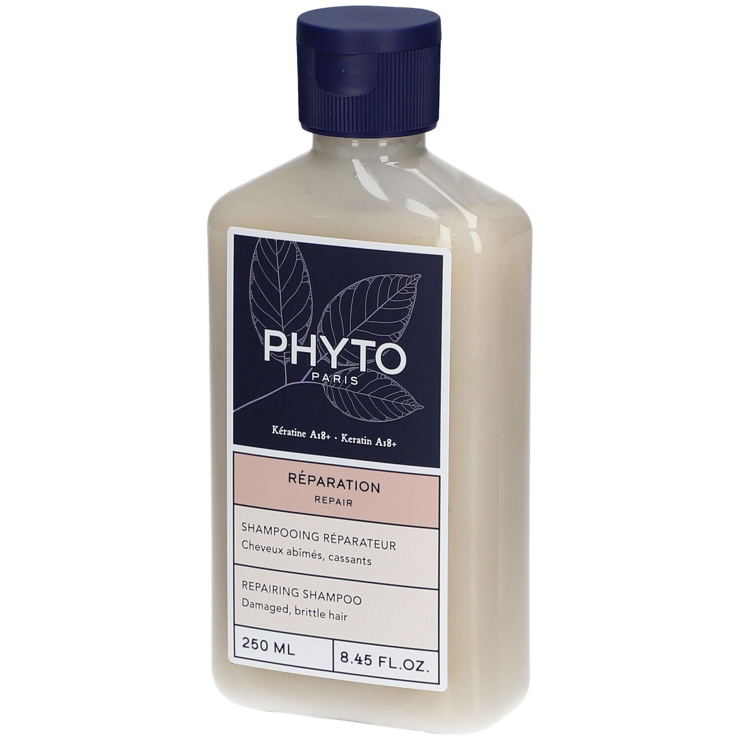 Fles PHYTO Repairing Shampoo. Blauw-wit etiket met info. 250 ml. Blauwe dop.