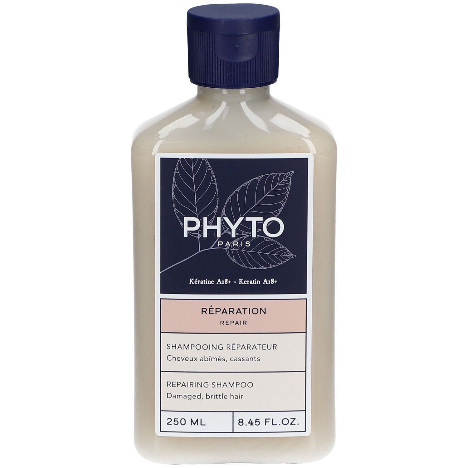 Fles PHYTO Repairing Shampoo. Blauw-wit etiket met info. 250 ml. Blauwe dop.