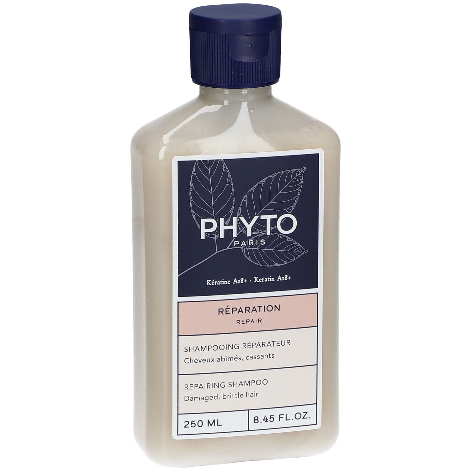 Fles PHYTO Repairing Shampoo. Blauw-wit etiket met info. 250 ml. Blauwe dop.