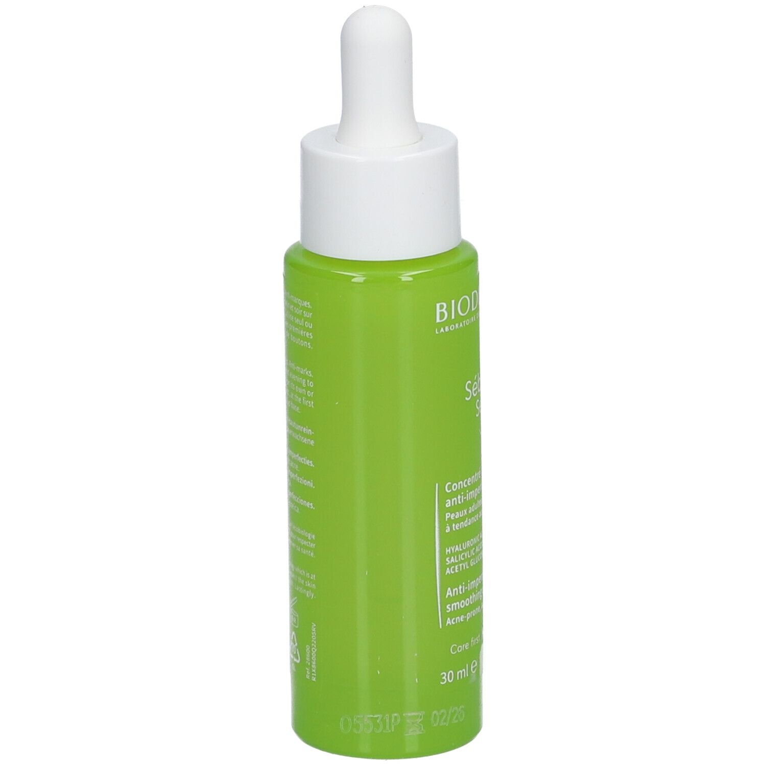 Flacon vert avec bouchon blanc et pipette. Dos avec texte. 30 ml.