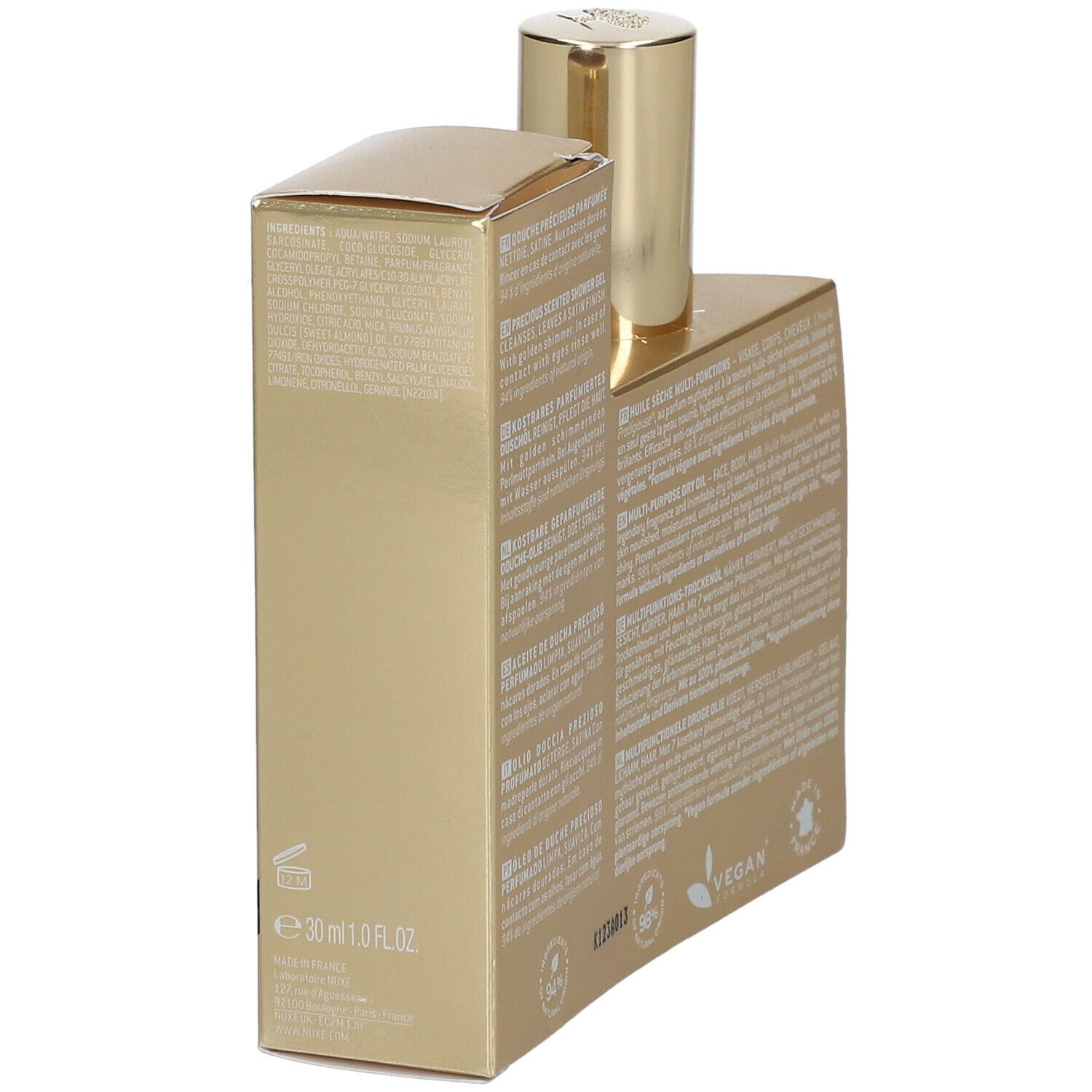 Emballage doré avec texte. Inscription: 30 ml 1.0 fl.oz. Logo végan. Ingrédients.