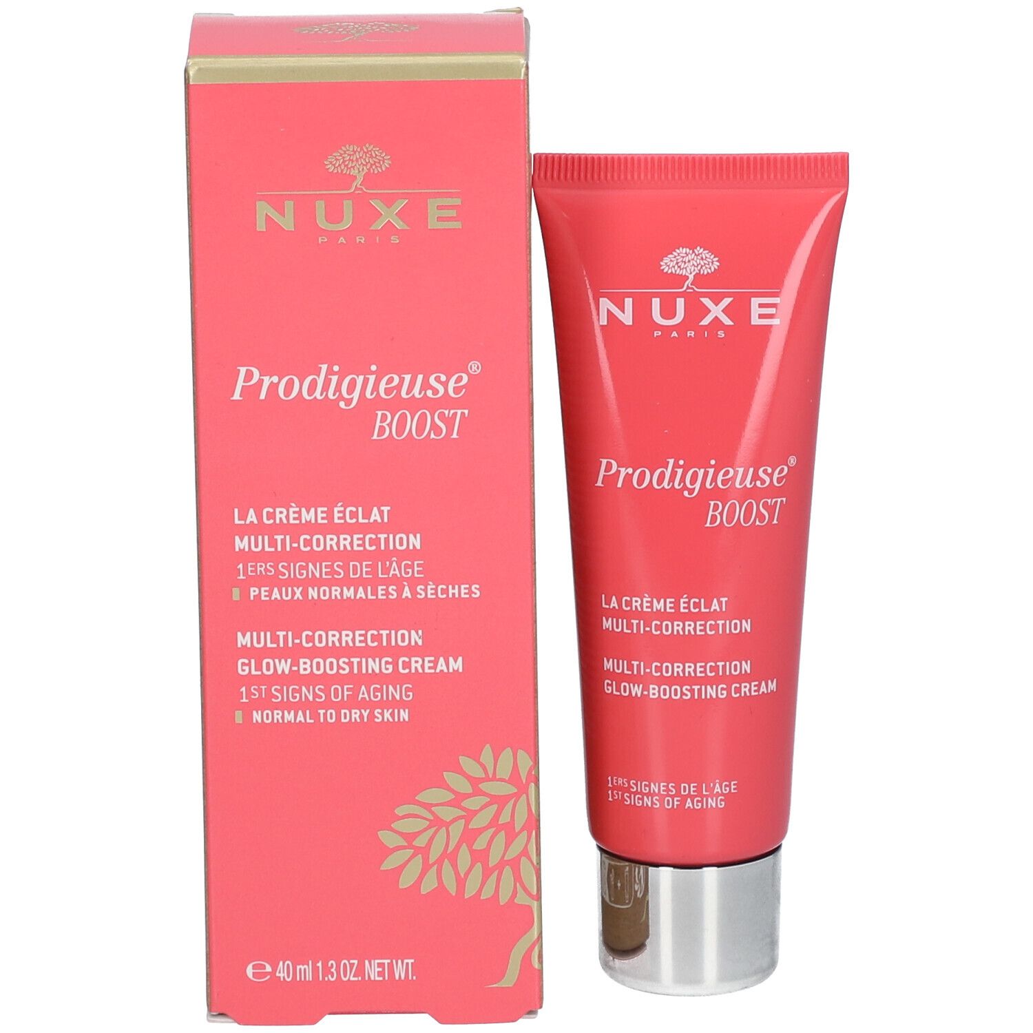 Roze doos en tube. Opschrift: Nuxe, Prodigieuse Boost, La Crème Éclat Multi-Correction, Multi-Correction Glow-Boosting Cream. 1st Signs of Aging.