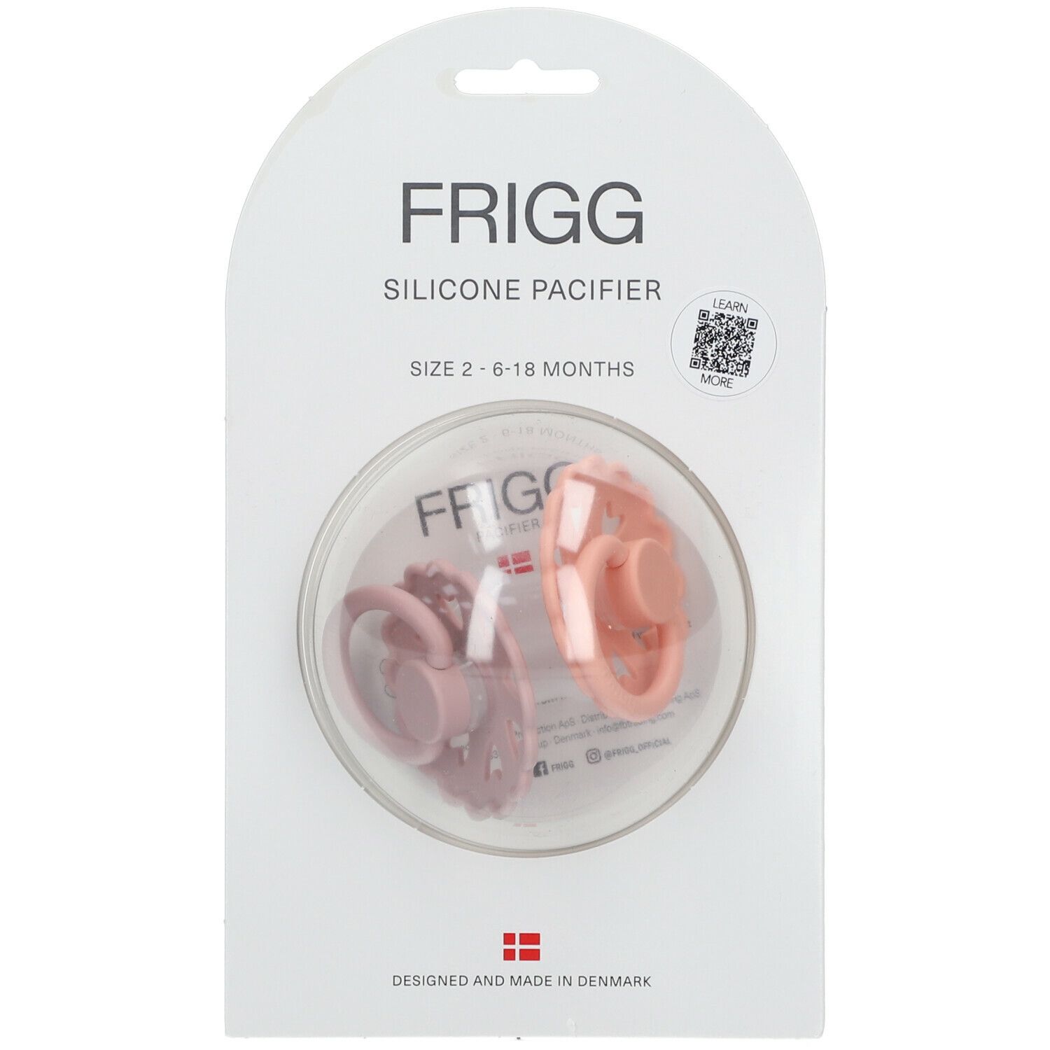 Emballage de deux sucettes FRIGG. Sucettes en silicone rose et orange. Taille 2, 6-18 mois.