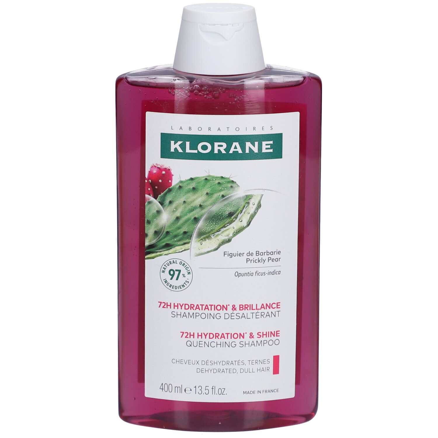 Flacon de shampooing Klorane. Liquide rose, bouchon blanc. Étiquette avec figue de Barbarie et texte.