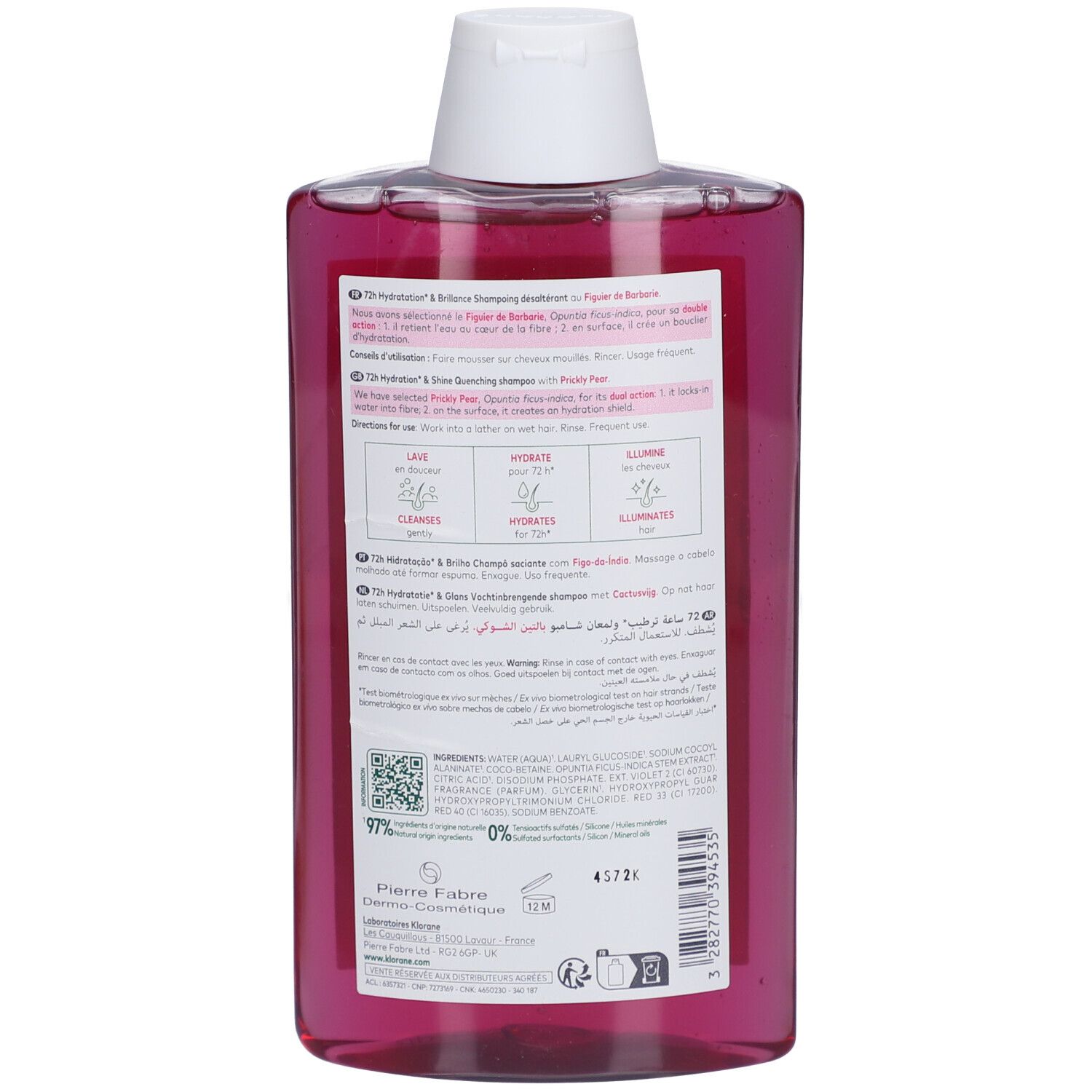 Dos du flacon de shampooing Klorane. Liquide rose, bouchon blanc. Texte et étiquette.