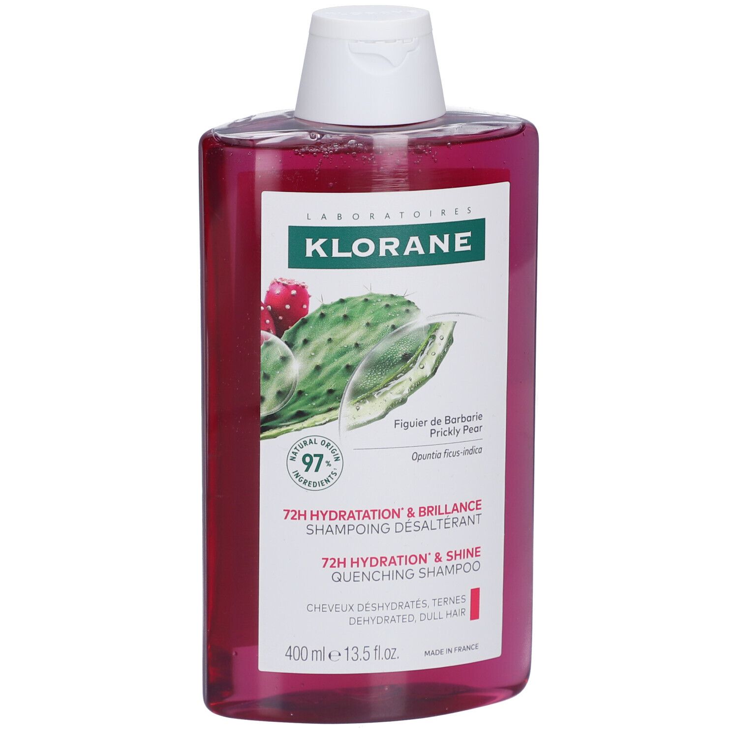 Flacon de shampooing Klorane. Liquide rose, bouchon blanc. Étiquette avec figue de Barbarie et texte.