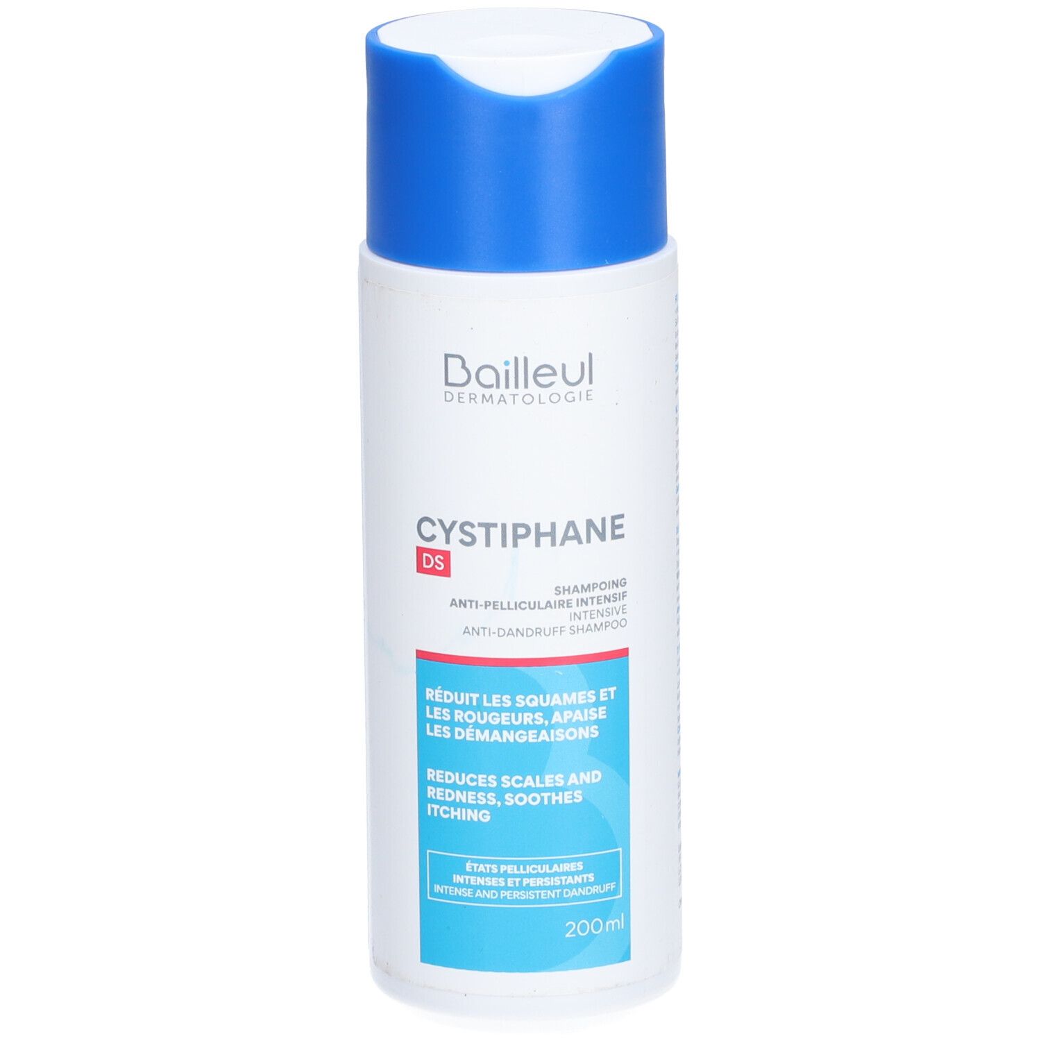 Flacon de shampooing blanc et bleu. Inscription: Baieul Dermatologie, Cystiphane DS, shampooing antipelliculaire. Réduit les squames, rougeurs, démangeaisons.