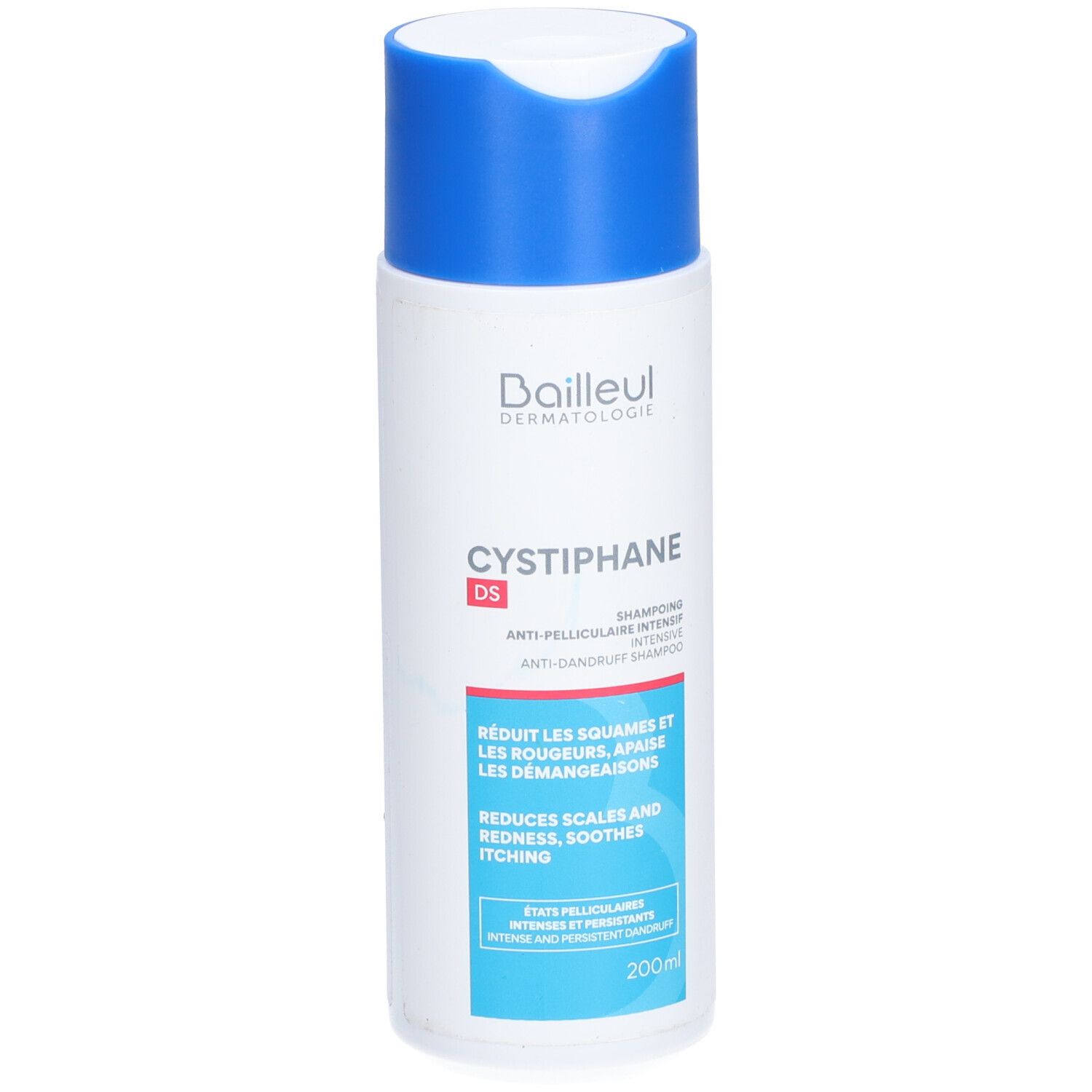 Flacon de shampooing blanc et bleu. Inscription: Baieul Dermatologie, Cystiphane DS, shampooing antipelliculaire. Réduit les squames, rougeurs, démangeaisons.