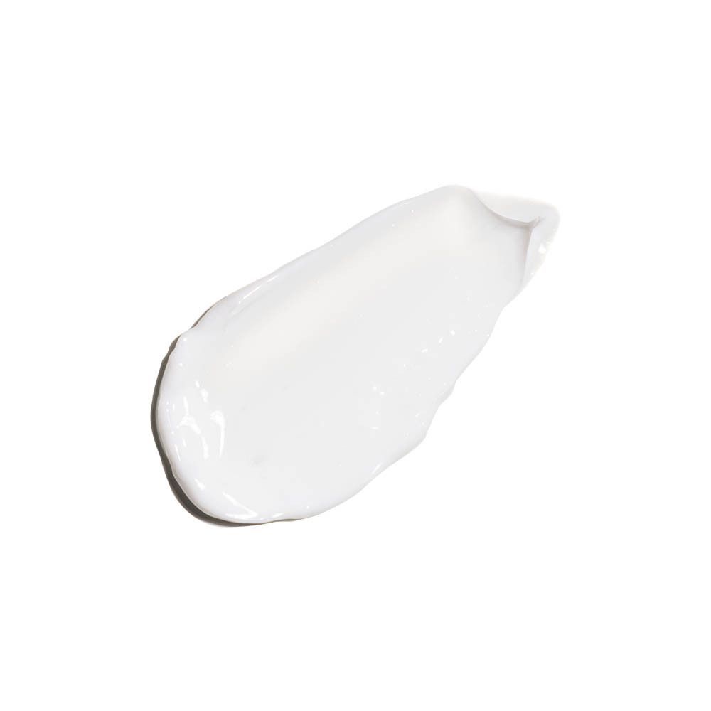 Éclaboussure de crème blanche. Sur une surface lisse.