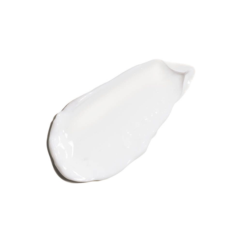 Witte crèmevlek op witte achtergrond.