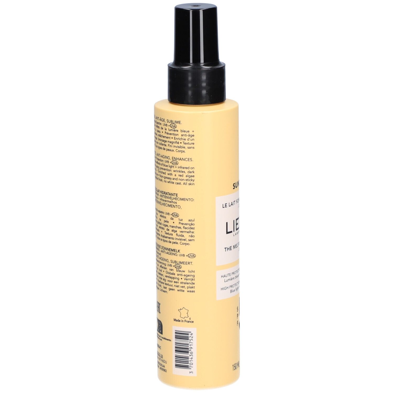 Achterkant van de zonnebrandlotionfles. Meertalige tekst. Gele fles met zwarte dop.