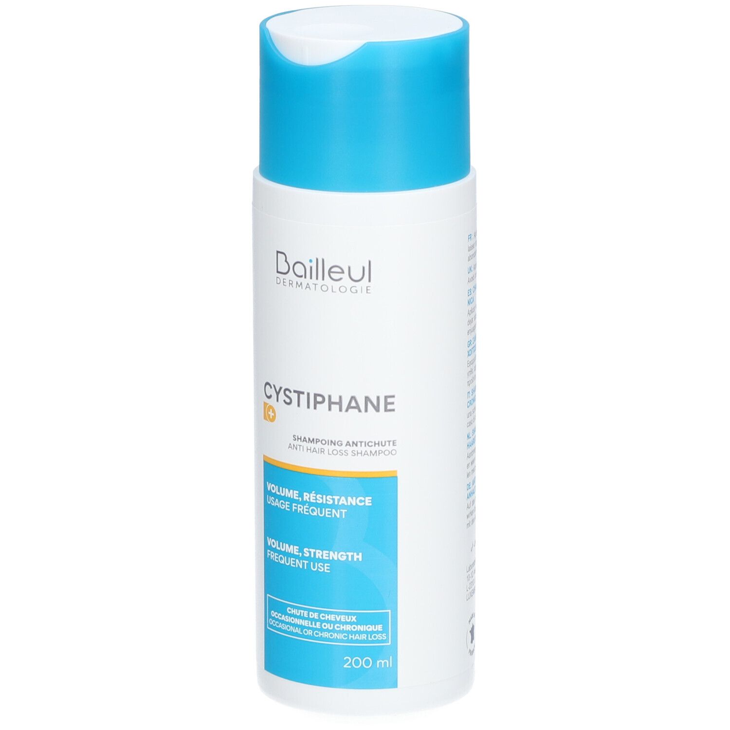 Flacon blanc et bleu de shampooing. Inscription: Cystiphane, Shampooing Antichute. Volume, résistance, usage fréquent.