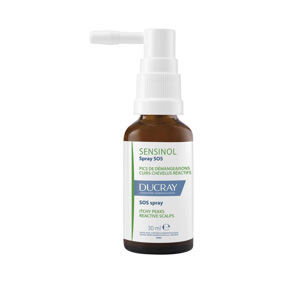 Flacon en verre brun avec vaporisateur blanc. Inscription : Sensinol Spray SOS, Ducray. 30 ml.