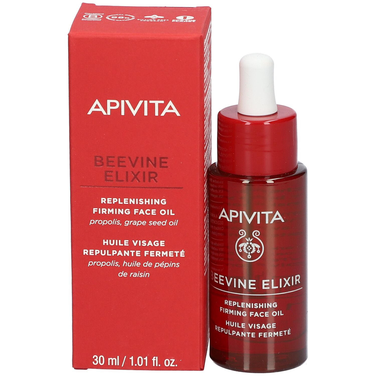 Flacon rouge avec compte-gouttes blanc. Inscription: APIVITA BEEVINE ELIXIR. Huile visage.