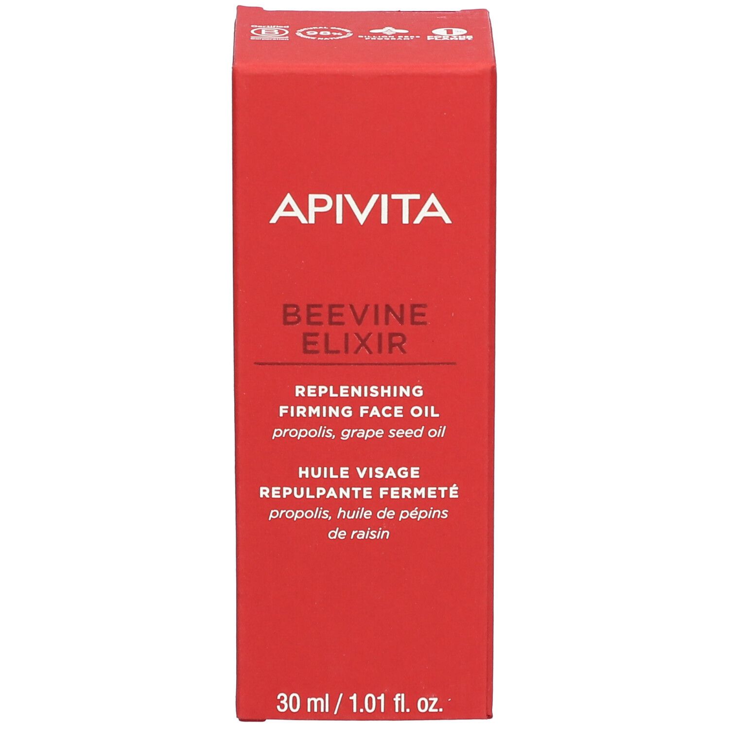 Flacon rouge avec compte-gouttes blanc. Inscription: APIVITA BEEVINE ELIXIR. Huile visage.