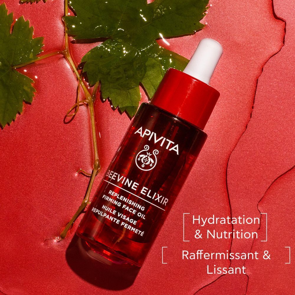 Boîte rouge avec inscription APIVITA BEEVINE ELIXIR. Huile visage. 30 ml.
