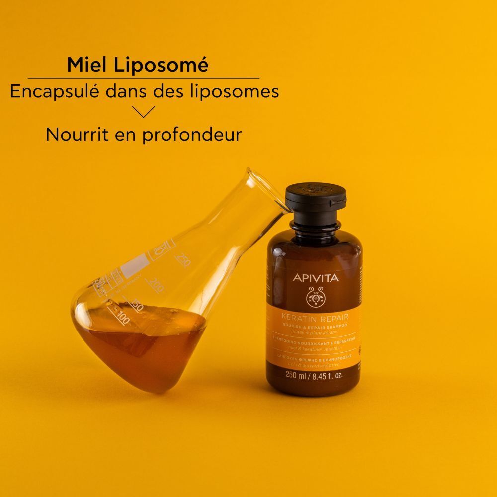 Fond jaune. Flacon et tube à essai. Texte: Miel Liposomé. Nourrit en profondeur.