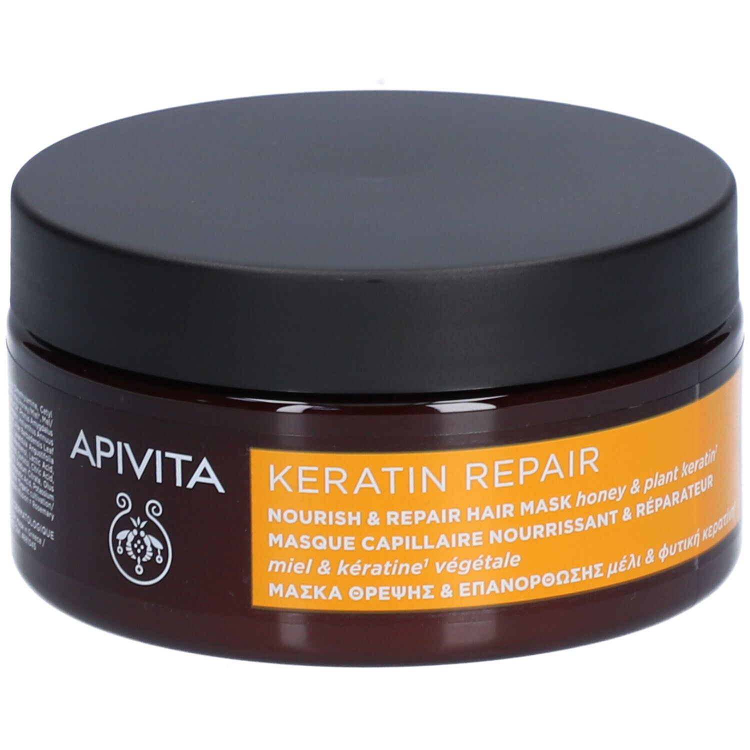 Pot brun avec couvercle noir. Inscription : Apivita, Keratin Repair, masque capillaire.