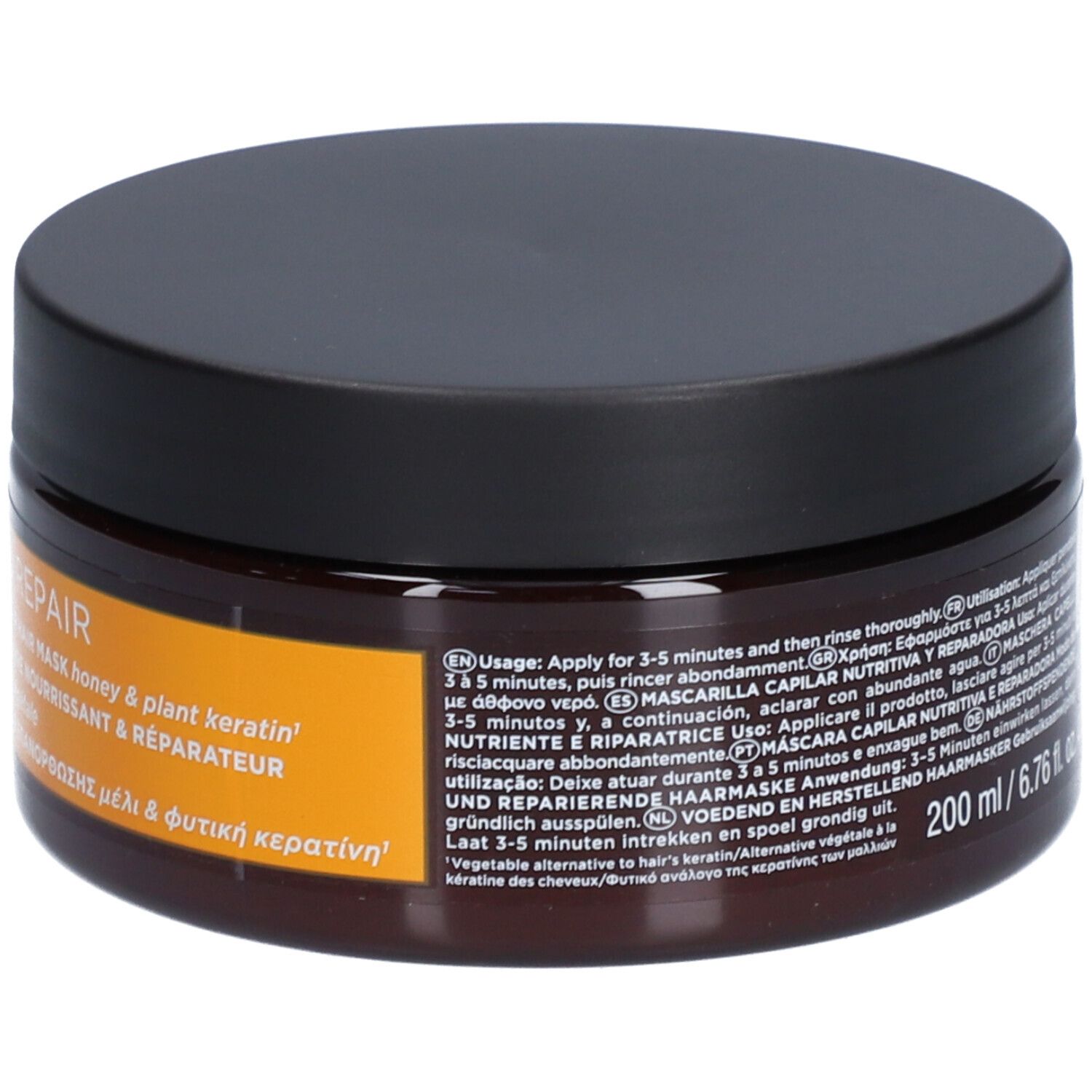 Pot brun avec couvercle noir. Inscription : Apivita, Keratin Repair, masque capillaire, 200 ml.