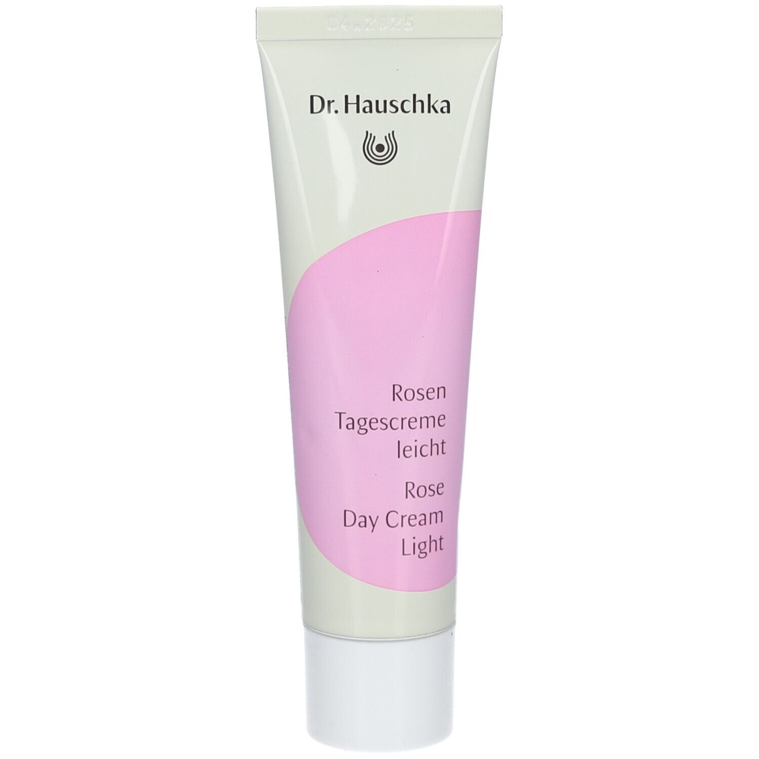 Tube de crème avec zone rose. Inscription : Dr. Hauschka, Rosen Tagescreme leicht, Rose Day Cream Light.