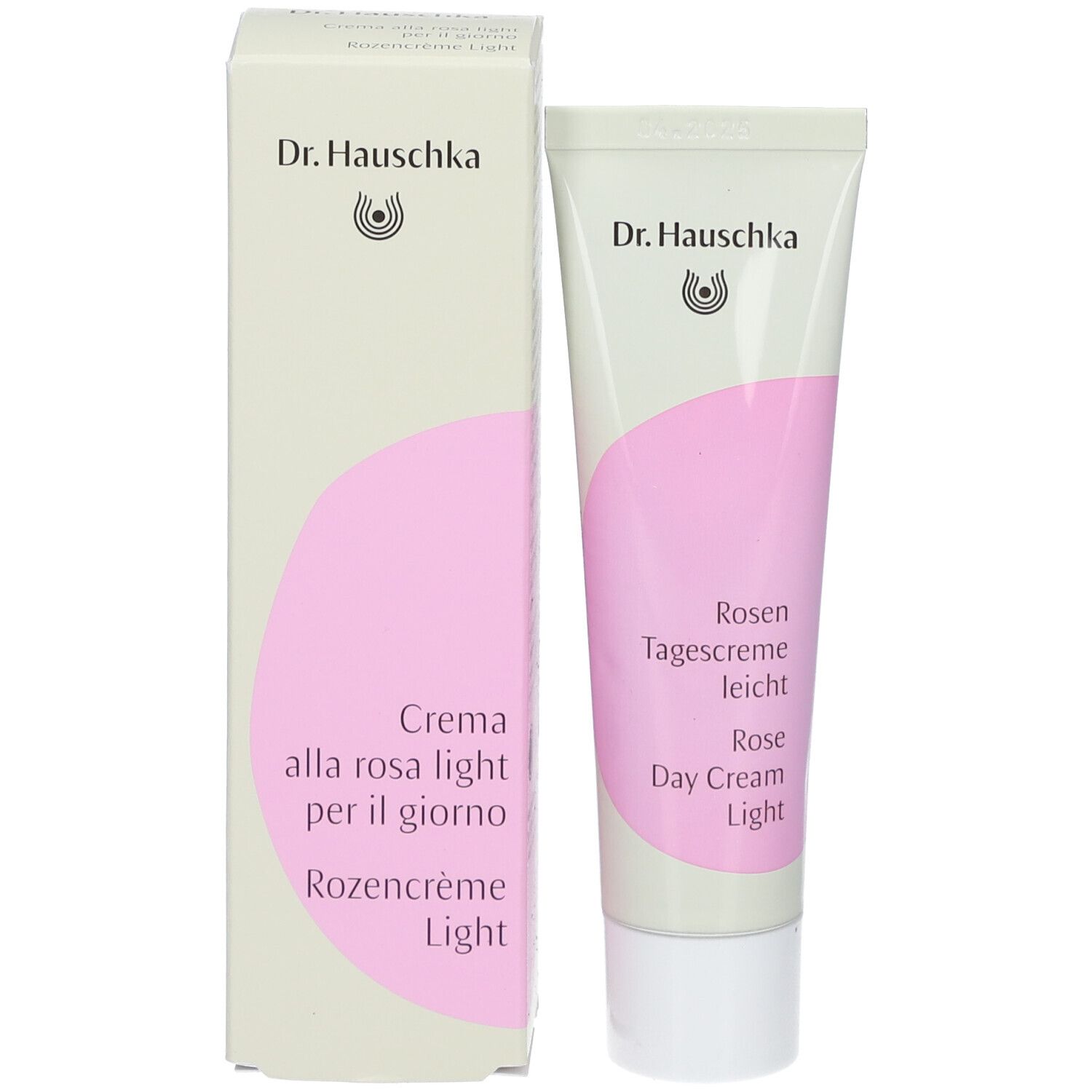 Tube de crème et carton. Inscription : Dr. Hauschka, Rosen Tagescreme leicht, Rose Day Cream Light, Crème alla rosa light per il giorno.