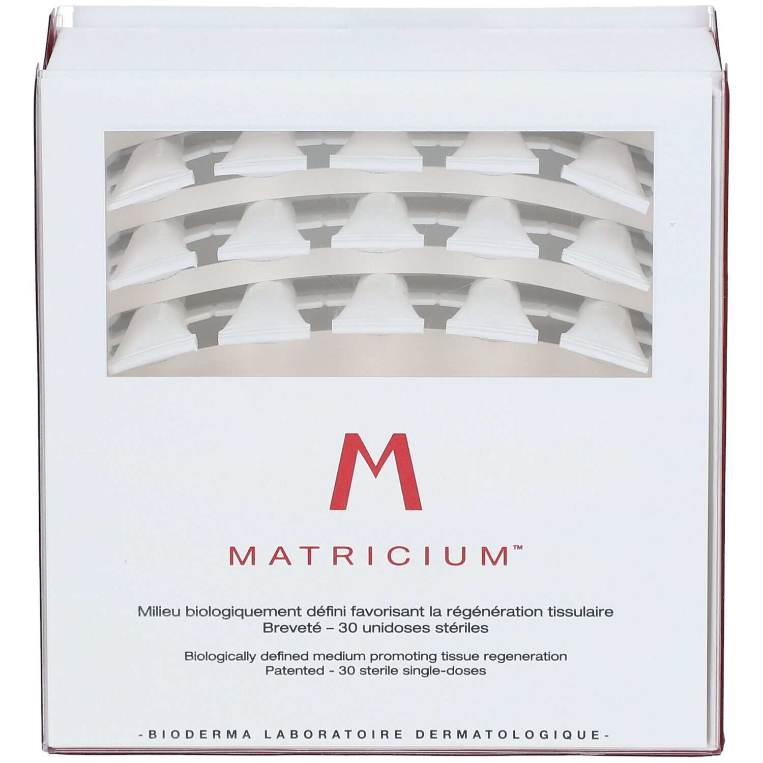 Verpakking "M Matricium" met venster. Bevat 30 unidoses. Logo en productnaam zichtbaar.