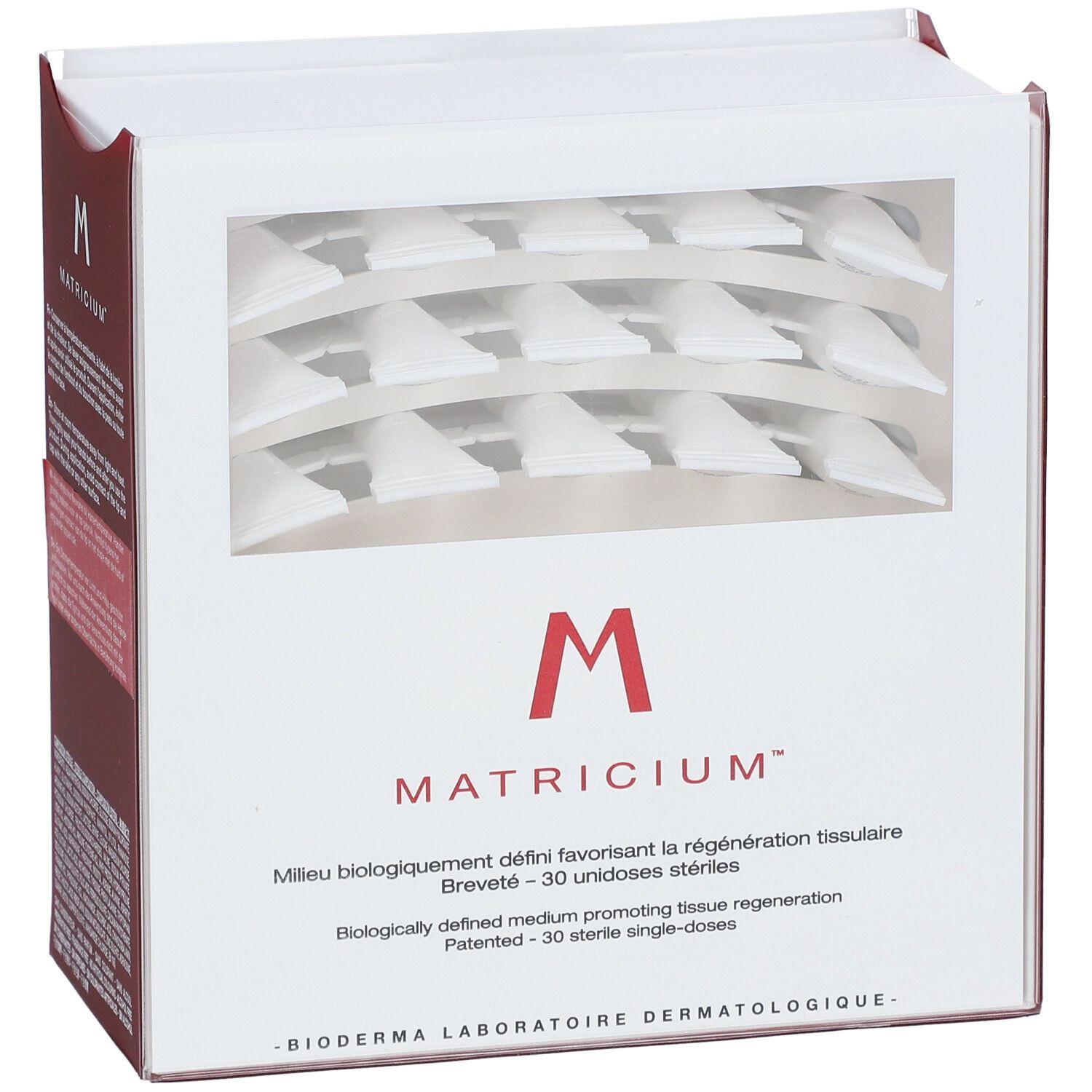 Verpakking "M Matricium" met venster. Bevat 30 unidoses. Logo en productnaam zichtbaar.