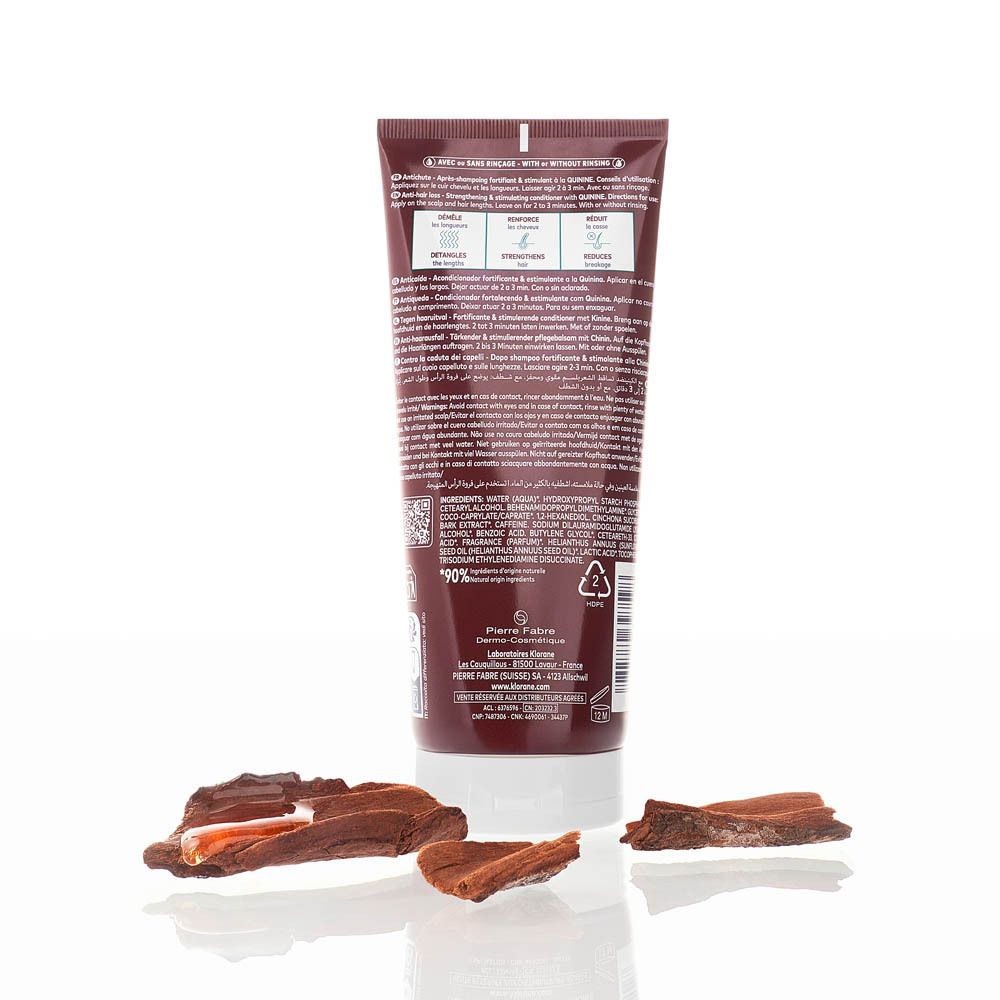Achterkant Klorane conditioner. Tekst, ingrediënten, recycling symbool. Bruine tube.