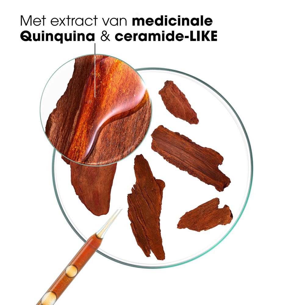 Ingrediënten van Klorane conditioner. Houtstukken, vloeistof in een schaal.