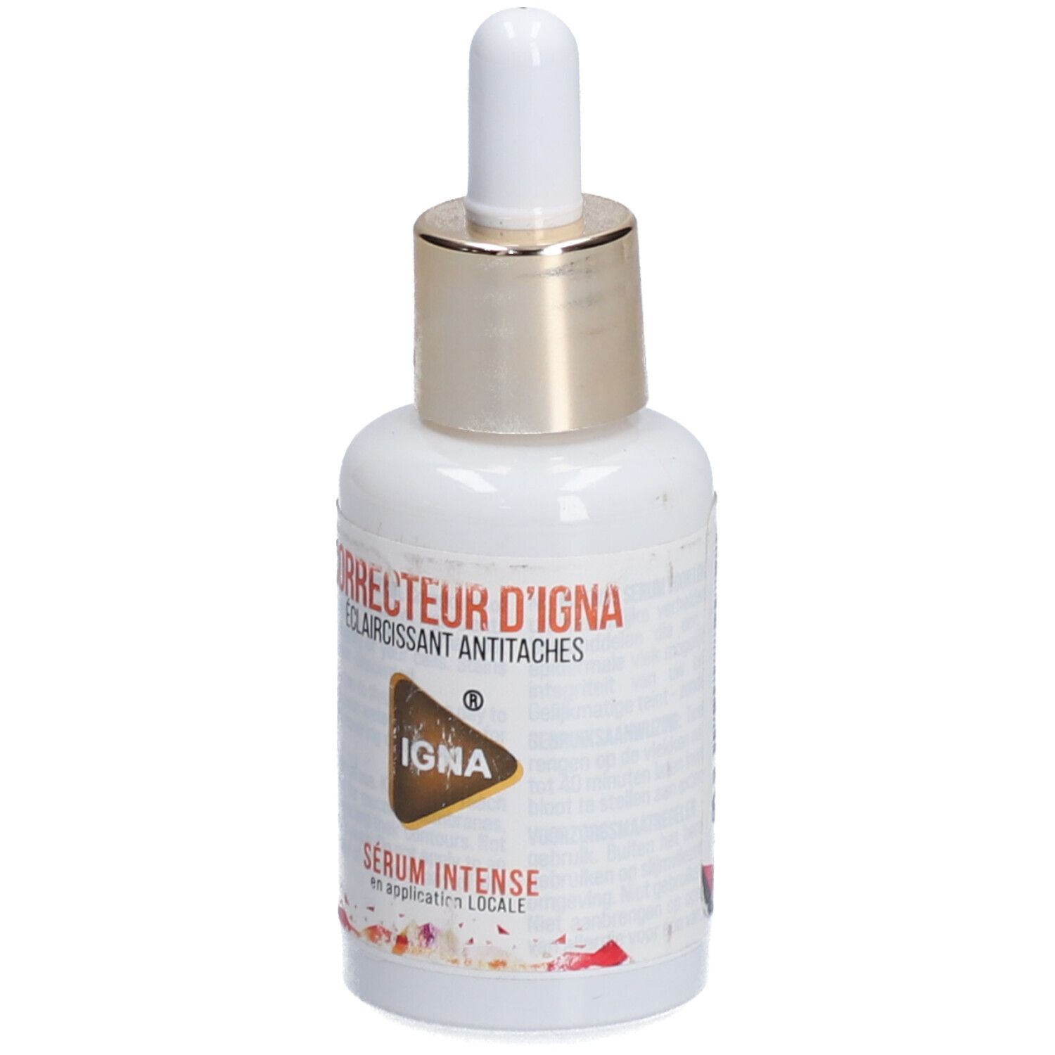 Weiße Flasche mit goldfarbenem Verschluss und Pipette. Aufschrift: CORRECTEUR D'IGNA, ECLAIRCISSANT ANTITACHES, IGNA, SÉRUM INTENSE.