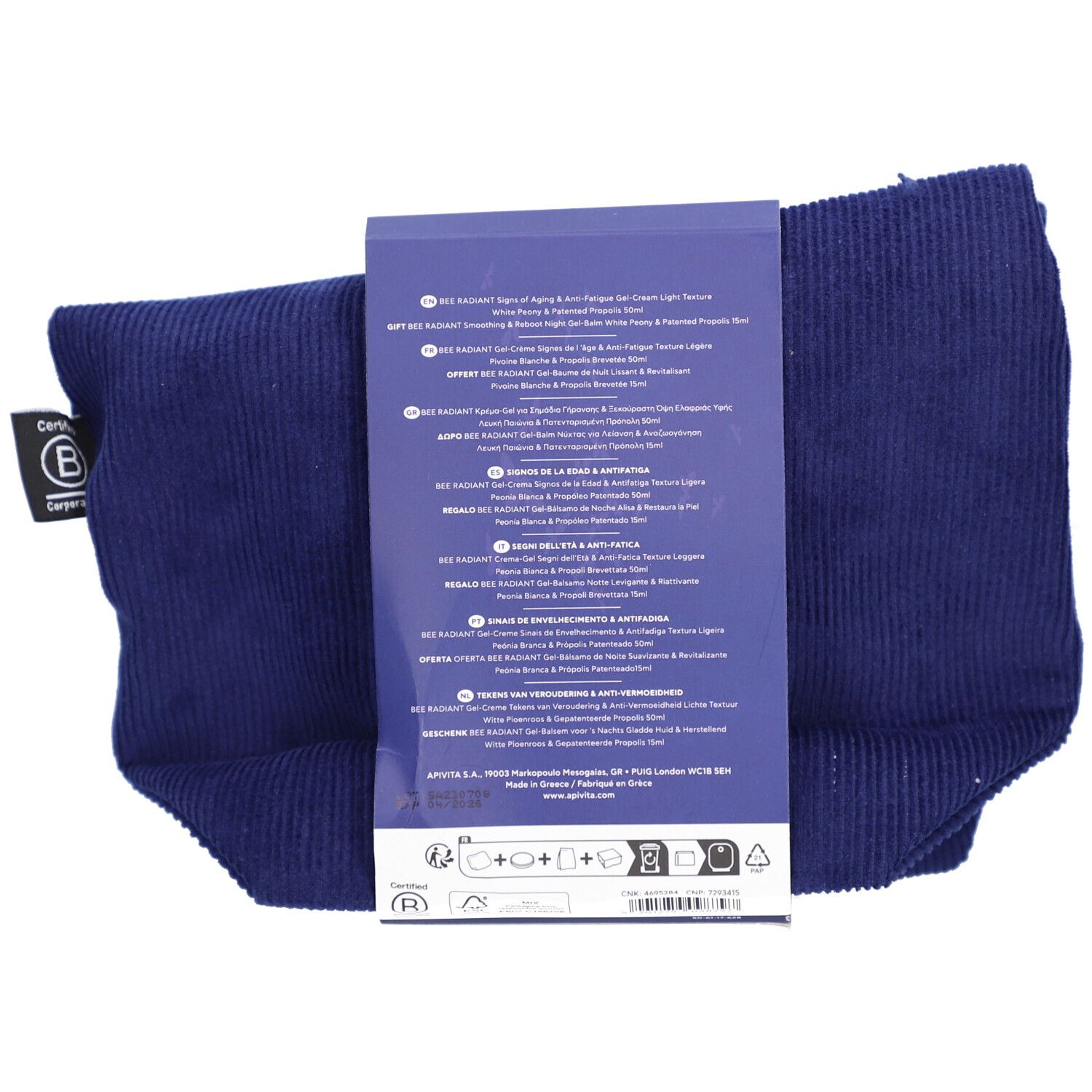 Vue arrière de la trousse de toilette bleu foncé avec emballage produit. Texte sur l'emballage en plusieurs langues.