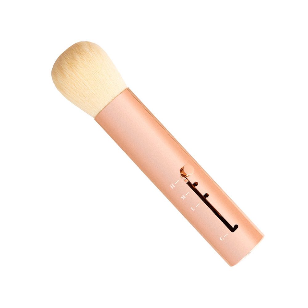 Uitschuifbare borstel met roségouden handvat en lichte borstelkop. Schuine weergave.