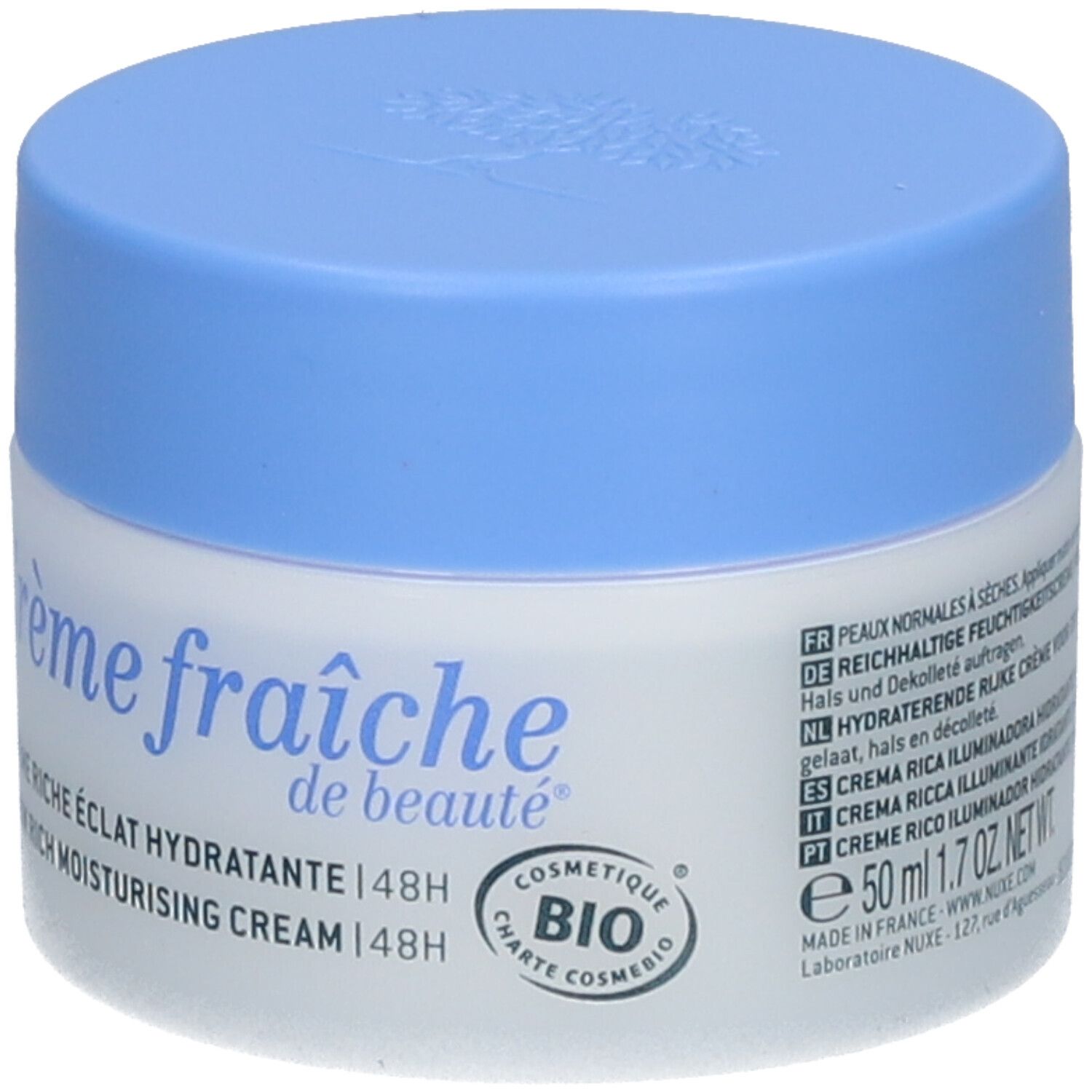 Pot de crème avec couvercle bleu. Inscription : Crème fraîche de beauté, NUXE Paris. COSMETIQUE BIO.