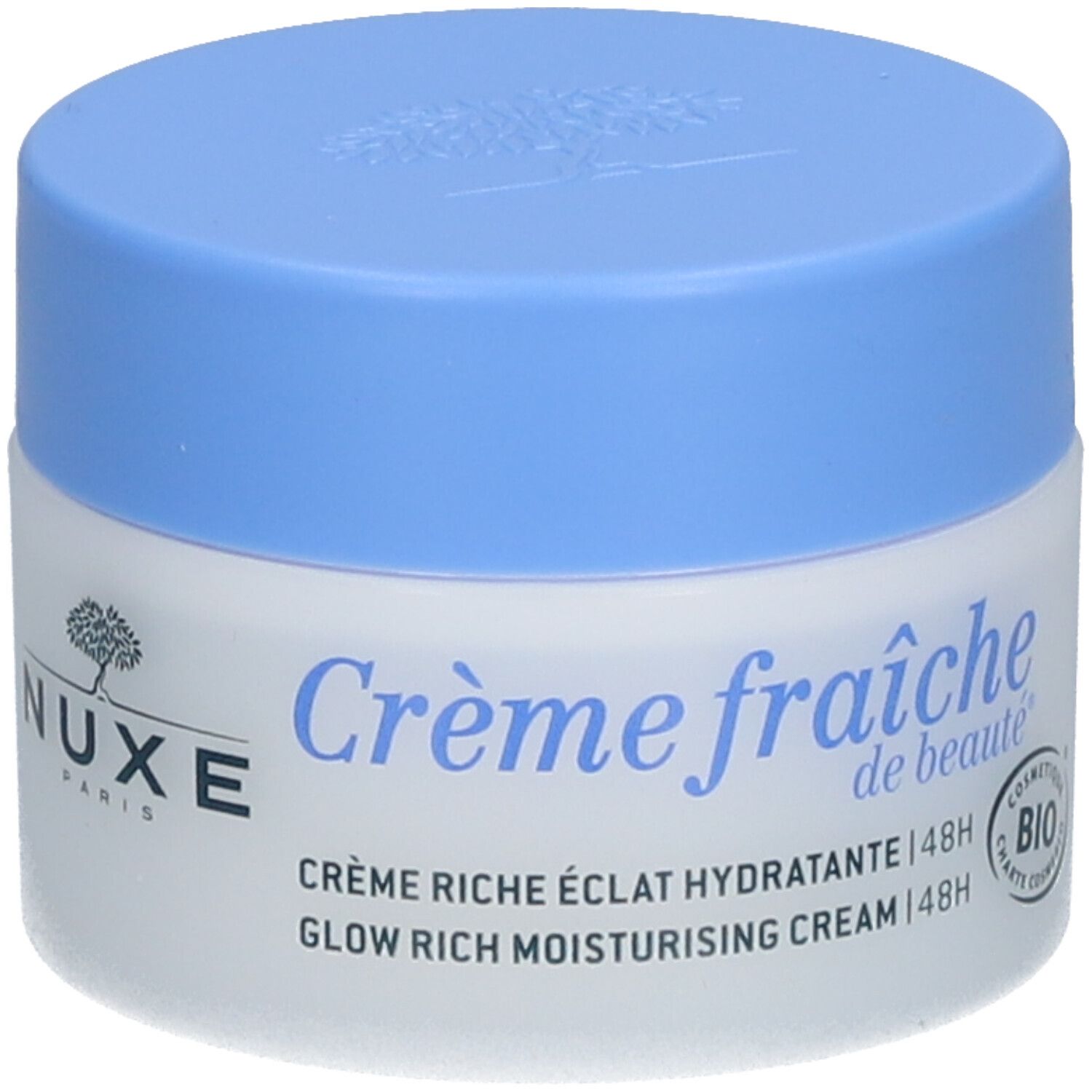 Pot de crème avec couvercle bleu. Inscription : Crème fraîche de beauté, NUXE Paris. Texte : Crème riche éclat hydratante 48h.