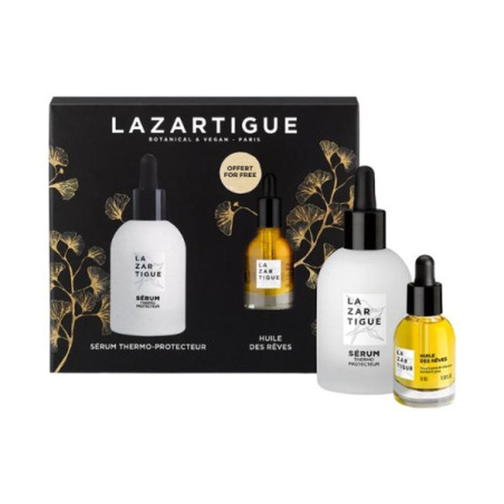 Coffret cadeau avec trois flacons. Inscription LAZARTIGUE. Deux flacons blancs, un marron. Texte: SÉRUM THERMO-PROTECTEUR, HUILE DES RÊVES.