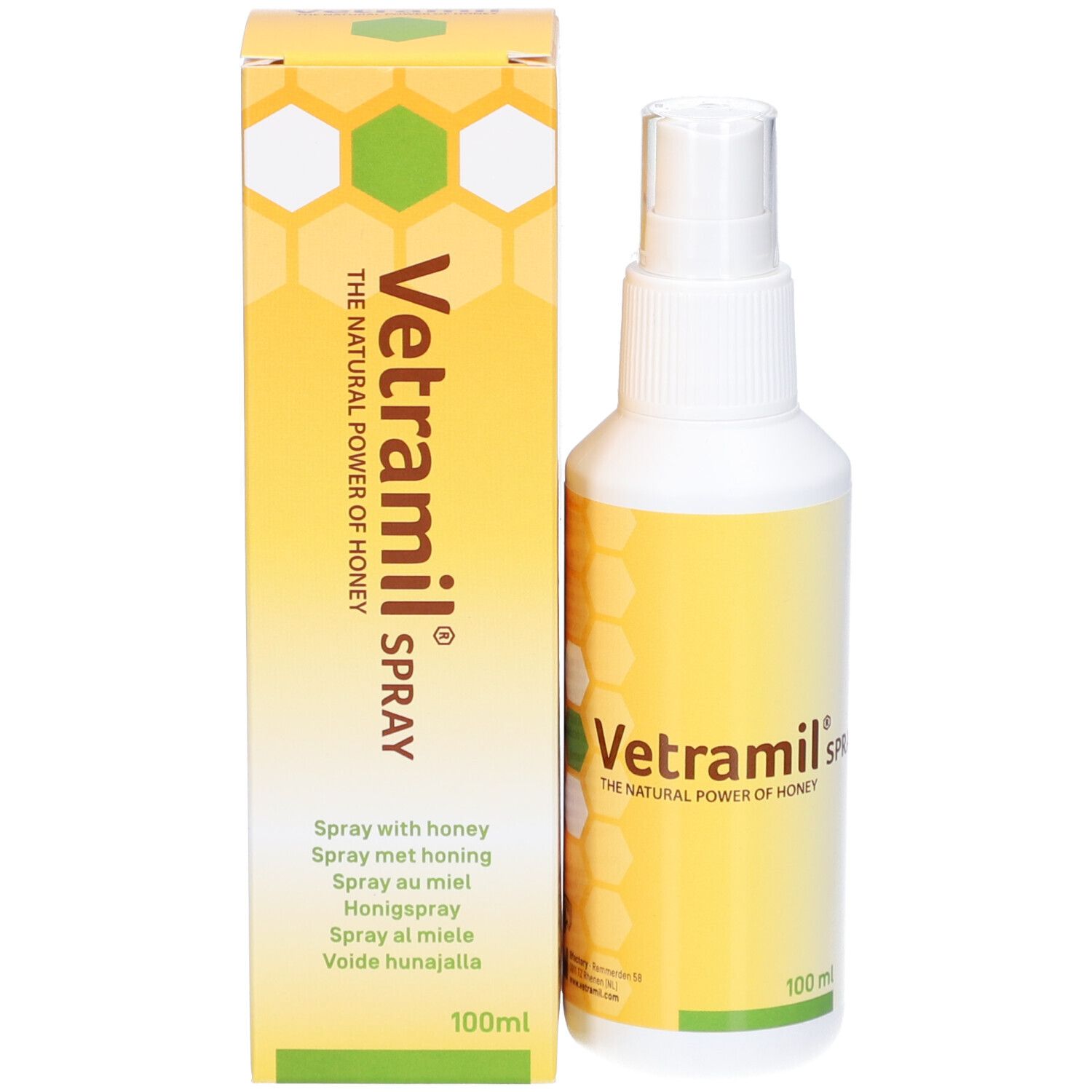 Sprayflasche und Karton. Aufschrift: Vetramil Spray, Honig. Gelb-weiße Verpackung mit Bienenwabenmuster.