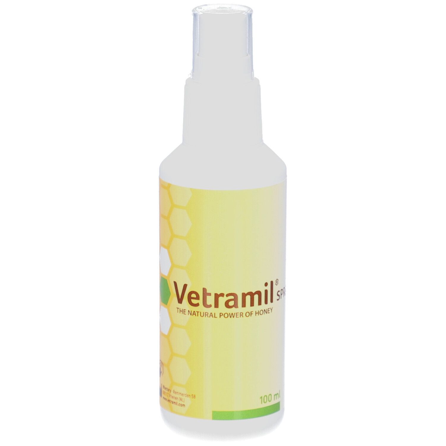 Weiße Sprayflasche mit gelbem Etikett. Aufschrift: Vetramil Spray, Honig. Transparenter Sprühkopf.