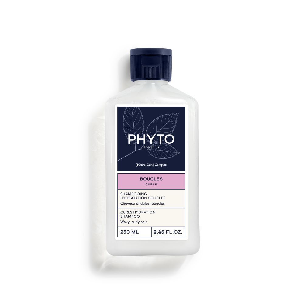 Fles Phyto Boucles shampoo. Wit, blauwe dop. Etiket met productinfo en merk.